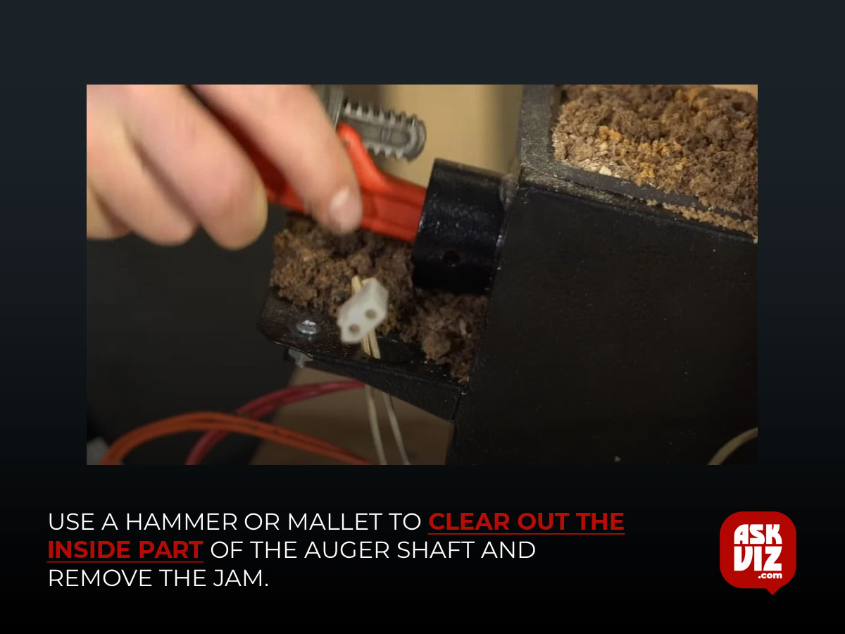 Use a hammer or mallet to clear out the inside part of the auger shaft and remove the jam askviz